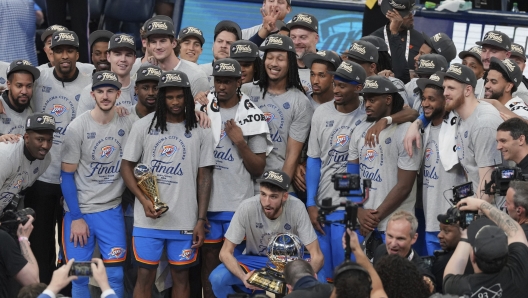 Oklahoma City Thunder players and coaches celebrate after Game 5 of the Western Conference finals of the NBA basketball playoffs against the Minnesota Timberwolves, Wednesday, May 28, 2025, in Oklahoma City. (AP Photo/Kyle Phillips)